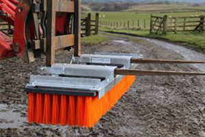 Forklift sweeper attachment on mud