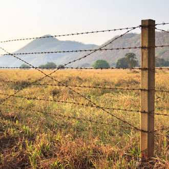 Barbed wire fence keeping farm safe